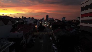 George Town, Penang, Malaysia - Aug 22 2024: Night sky over George Town reveals a glowing sunset