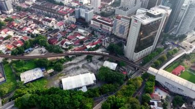 Bukit Bintang, Kuala Lumpur, Malaysia - Dec 07 2024: Cityscape with a LRT train running through it