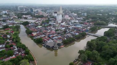 Alor Setar, Kedah, Malaysia - Jan 08 2024: The Kedah River flows peacefully in this wide drone shot.