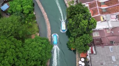 Bandar Hilir, Melaka, Malaysia - Jan 12 2024: The scenic Melaka River flows gently with boat passing by.
