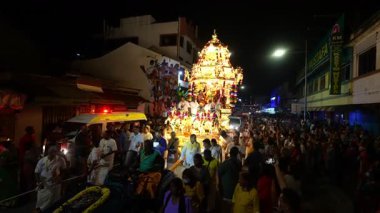 George Town, Penang, Malaysia - Jan 24 2024: Gold carrying Lord Murugan moves through the crowd.