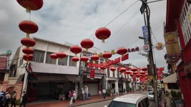 Bandar Hilir, Melaka, Malaysia - Mar 05 2024: Gimbal camera tracking lively scenes in Melaka cultural heart.