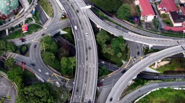 Bukit Bintang, Kuala Lumpur, Malaysia - Dec 14 2024: Busy highway with cars and trucks on it aerial view