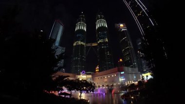 Bukit Bintang, Kuala Lumpur, Malaysia - Dec 14 2024: KLCC tower buildings lit up at night celebrating 25 years anniversary