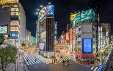 Panoramic night view of brightly lit shops and restaurants along Shinjuku Rambling Road and Musashino Street in Shinjuku, Tokyo, Japan on 23 September 2023 clipart