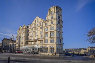 The Empire Hotel building and entrance in sunset light in Bath, UK on 11 January 2025 clipart