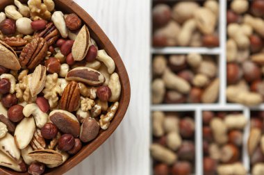 Mix of various nuts in the bowl in rustic style