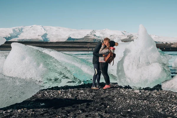 Couple in Love at lake Jokulsarlon, Iceland. 