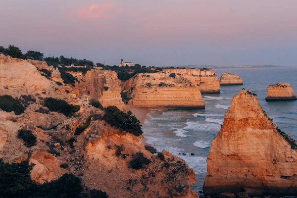 Sunset at the most beautiful Marinha Beach from Cliff in Lagoa, Algarve