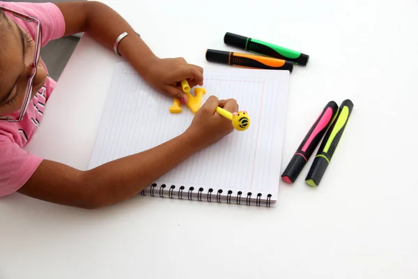 4-year-old brunette Latina girl with dysgraphia, writing ability disorder, difficulty or inability to write written texts with intellectual and neurological deficiency, learning and language disorder