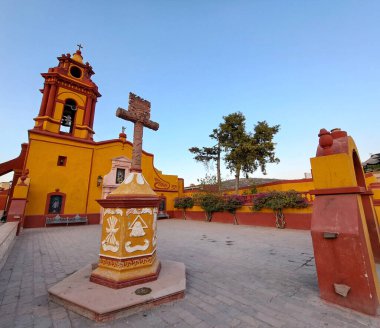 Magical town Pea de Bernal in Queretaro Mexico in the center The Temple of San Sebastian is located in the Main Square surrounded by gardens clipart