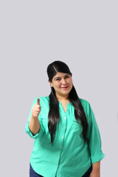 stock image 30-year-old Mexican adult woman shows her thumb indelible electoral ink as proof of vote to prevent fraud