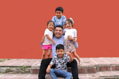 Divorced single dad with his two sons and two brunette Latina daughters spend quality time together celebrate Father's Day