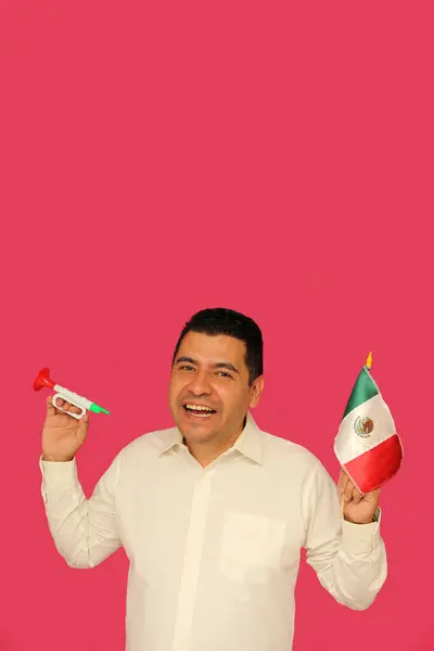 stock image Dark-skinned Mexican adult man with Mexico flag and toy trumpet celebrates national holidays like Independence Day and Revolution