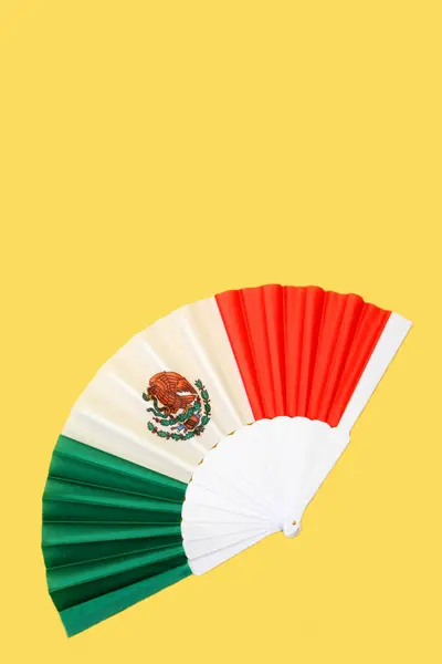 stock image Tricolor fan with the colors of the Mexican flag as a decorative item, the flag of Mexico national to celebrate holidays of Independence Day and Revolution Day