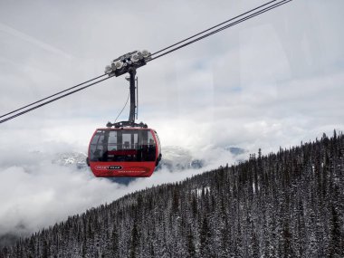 British Columbia, Whistler, Canada - Mar 16 2022: The Peak 2 Peak Gondola is a tricable gondola lift at Whistler Blackcomb Resort in Whistler, British Columbia, linking Whistler Mountain's Roundhouse clipart