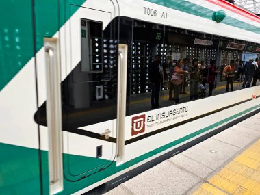 Mexico City, Mexico - Jan 8 2025: Insurgente Train is an interurban transport that connects Santa Fe in CDMX with Toluca, part of the Mexican mobility system clipart