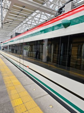 Mexico City, Mexico - Jan 8 2025: Insurgente Train is an interurban transport that connects Santa Fe in CDMX with Toluca, part of the Mexican mobility system clipart