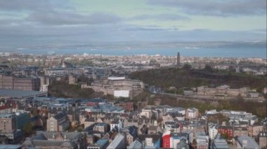 Panorama of Edinburgh city centre from above in the morning. 4k video footage with panning camera motion. Scotland, United Kingdom