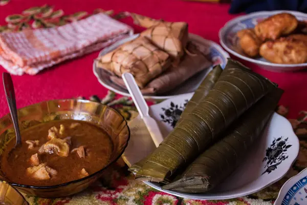 stock image several traditional Indonesian food menus, chicken opor, egg opor, and ketupat are served in a close up concept