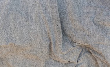 Örgü detaylarıyla gri kumaş dokusu