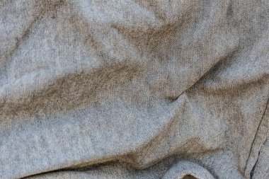 Örgü detaylarıyla gri kumaş dokusu