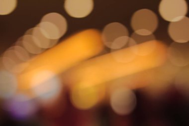 Yumuşak, sıcak, altın bir ışık Bokeh daireleri güzel, soyut bir arkaplan dokusu etkisi yaratıyor.