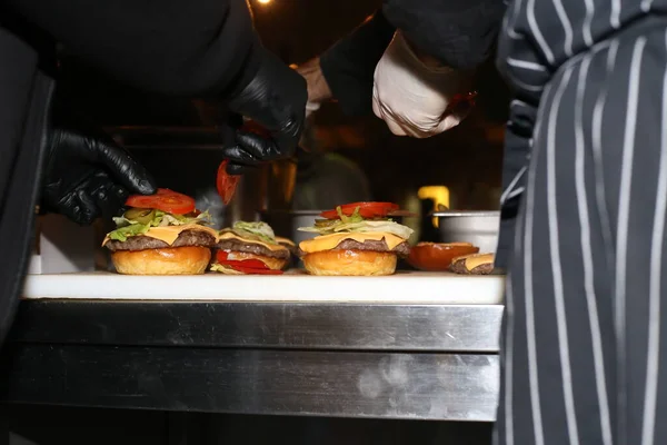 stock image chef preparing a burgers in a restaurant 