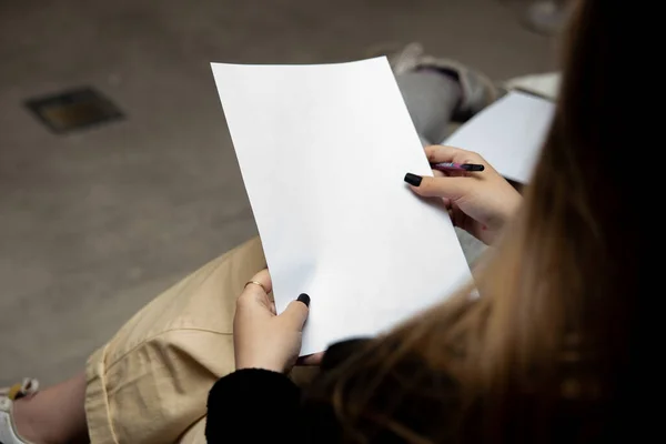 stock image cropped image of young woman holding blank paper
