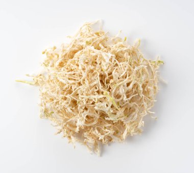 Dried Kiriboshi Daikon placed on a white background. Kiriboshi-daikon is a Japanese food. View from above.