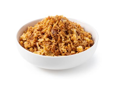 Fried onions in a bowl on a white background. Crispy fried onions. 