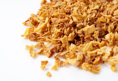 Fried onions on white background. Crispy fried onions. 