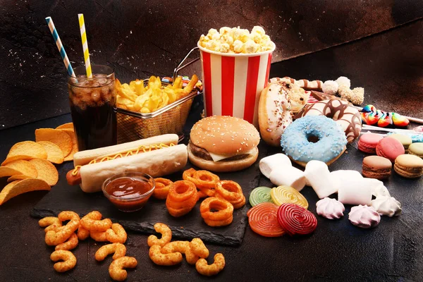 Unhealthy products. food bad for figure, skin, heart and teeth. Assortment of fast carbohydrates food.
