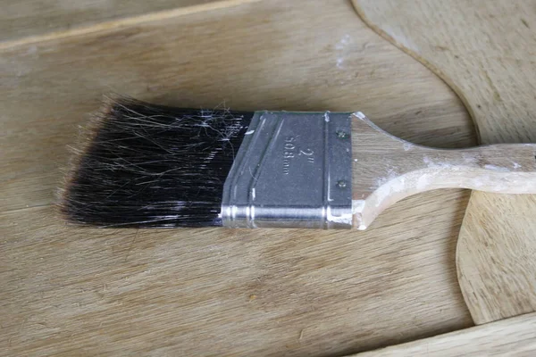 stock image paint brush on wooden table