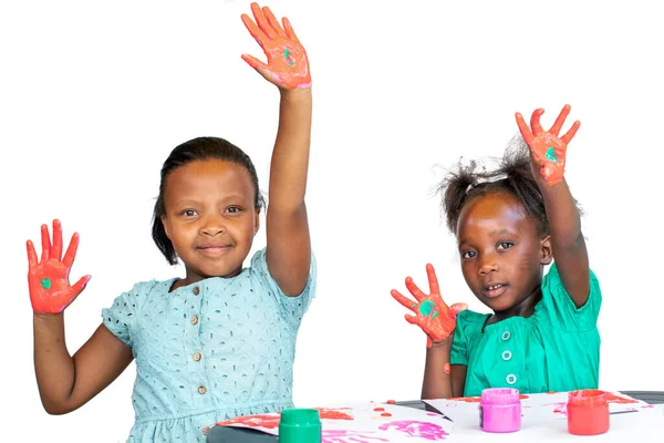 Two African Girls Having Fun Color Paint Table Isolated White — Foto de Stock