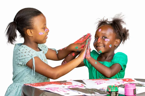 Two African Girls Having Fun Color Paint Table Isolated White — Foto de Stock