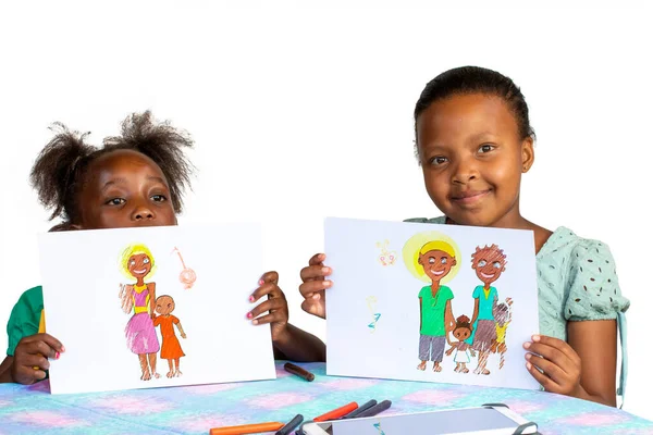 Two African Girls Showing Color Paintings Table Isolated White Background — Stockfoto