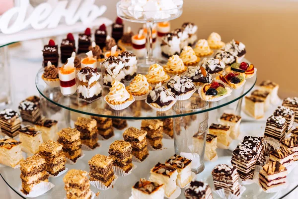 Delicious sweets on candy buffet. Wedding. Reception.