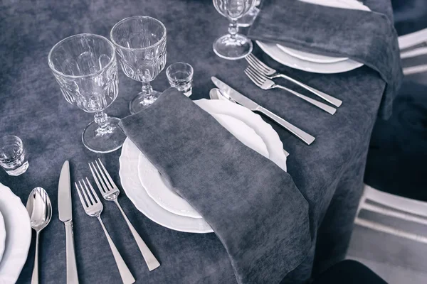 Gray color table decorations. Luxurious elegant table service for a wedding banquet. we are waiting for the guest