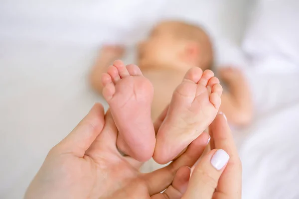 Maternal Love Concept Closeup Mom Holding Feet Her Cute Little — Stock Photo, Image
