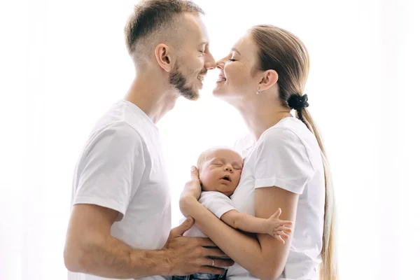 Young Women Man Kissing Hold Newborn Arms Window — Stock Photo, Image