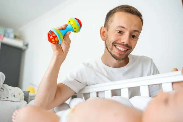 Young Father Playing Rattle Toy Swinging Crib Calming Baby — Stock Photo, Image