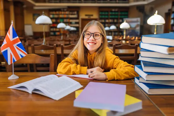 Laughing Smiling Schoolgirl Yellow Sweater Glasses Sitting Table School Library — Stock Photo, Image