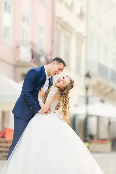 Groom Hugs Bride Waist Smile City Street — Stock Photo, Image