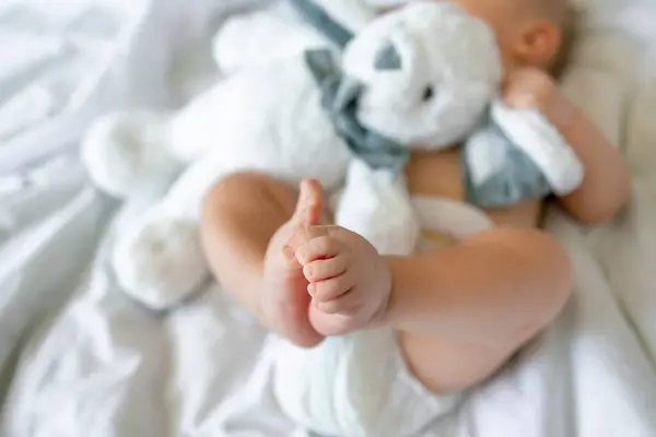 Baby Legs Bed Playing Bunny Toy — Stock Photo, Image
