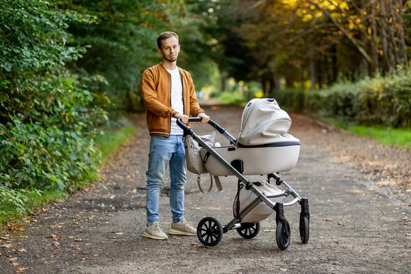 Father Little Son Walking Baby Stroller Autumnal Park Spending Time — Stock Photo, Image