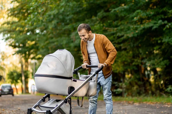 Happy Father Looking Pushing Infant Baby Stroller While Walking Park — Stock Photo, Image