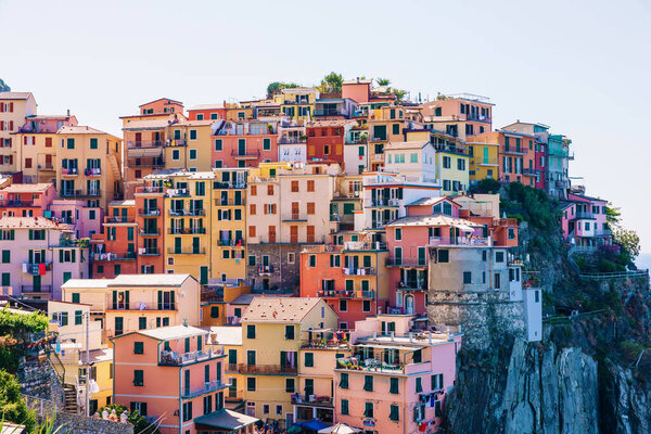 View of colorful houses of traditional Italian architecture. small town on a rocky shore of the ocean. Italy.