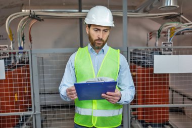 man engineering technician in control room, inspection service or industry maintenance.