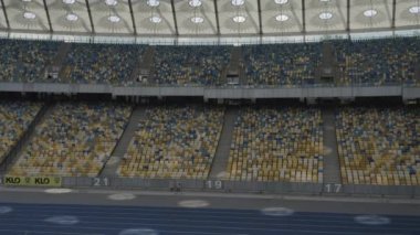 Olimpik Stadyum. Kyiv. Ukrayna. Şehir merkezi. Futbol sahası. Çağdaş tasarım. Hava fotoğrafçılığı. Tribünler. Hayranlar için yerler.